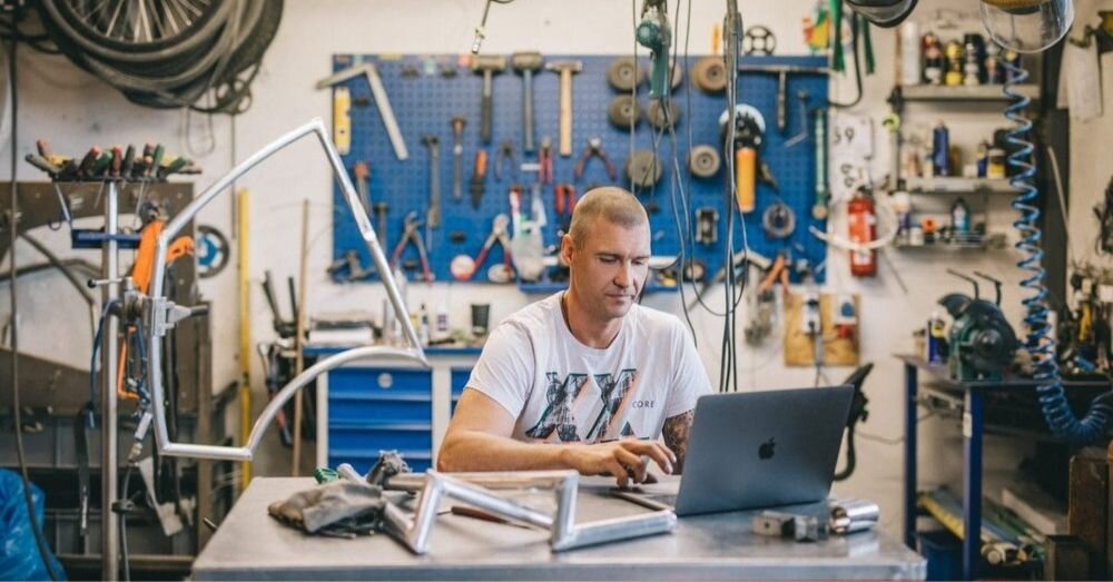 A production manager tracking manufacturing production with software.